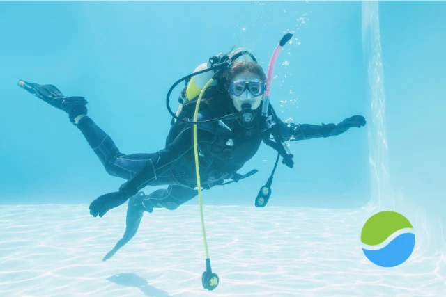 A single scuba diver swims underwater