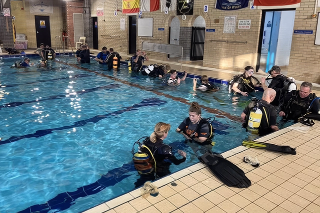 A group of people in scuba gear