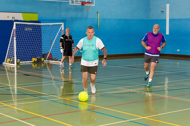 Veterans Football A male pickleball player in sports hall